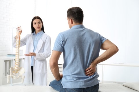 Doctor explaining chiropractic adjustments