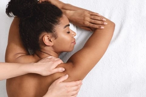Muscle Spasm Treatment – Suffolk Physical Therapy & Chiropractic Doctor providing muscle spasm treatment to a patient suffering from muscle pain after a car accident at Suffolk Physical Therapy & Chiropractic
