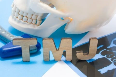 TMJ Treatment Near Me – Suffolk Physical Therapy & Chiropractic Patient receiving TMJ treatment near me to relieve jaw pain and discomfort at Suffolk Physical Therapy & Chiropractic