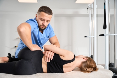 Picture of woman getting adjusted after searching chiropractor near me in Suffolk County, NY