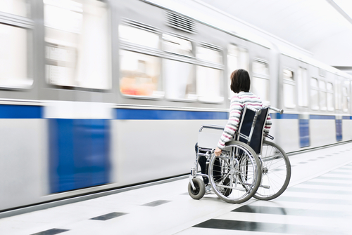 Picture of a wheelchair patient in front of a metro seeking physical therapy in Long Island